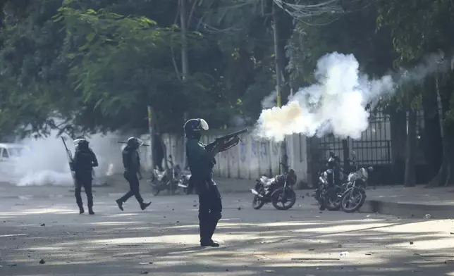 Police fire tear gas shells and rubber bullets to disperse students shouting slogans in favor of quota system in public service at the university campus, in Dhaka, Bangladesh, Wednesday, July 17, 2024. (AP Photo/Rajib Dhar)