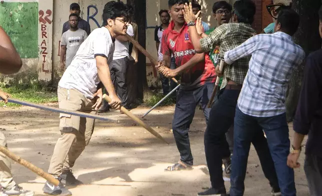 Students clash over quota system at Jahangir Nagar University at Savar outside Dhaka, Bangladesh, Monday, July 15, 2024. Police have fired tear gas and charged with batons overnight during violent clashes between a pro-government student body and student protesters, leaving dozens injured at a leading public university outside Bangladesh's capital over quota system in government jobs, police and students said Tuesday.(AP Photo/Abdul Goni)