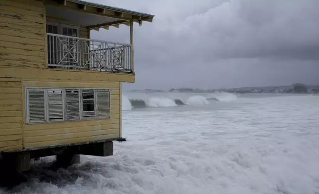 Waves batter a pier during the pass of Hurricane Beryl in Bridgetown, Barbados, Monday, July 1, 2024. (AP Photo/Ricardo Mazalan)