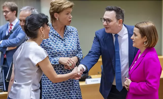 Czech Republic's Foreign Minister Jan Lipavsky, second right, greets Belgium's Foreign Minister Hadja Lahbib, left, as Romania's Foreign Minister Luminita-Teodora Odobescu, right, look on, ahead of a meeting of EU foreign ministers at the European Council building in Brussels, Monday, July 22, 2024. European Union foreign ministers on Monday meet to discuss Russian aggression against Ukraine and the situation in the Middle East. (AP Photo/Geert Vanden Wijngaert)