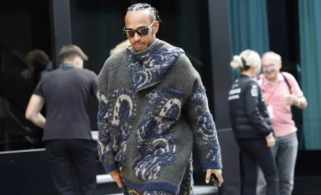 Mercedes driver Lewis Hamilton of Britain arrives in the paddock ahead of the Formula One Grand Prix at the Spa-Francorchamps racetrack in Spa, Belgium, Thursday, July 25, 2024. The Belgian Formula One Grand Prix will take place on Sunday. (AP Photo/Geert Vanden Wijngaert)