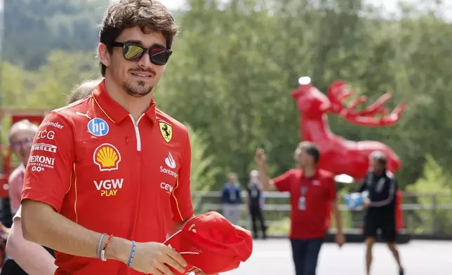 Ferrari driver Charles Leclerc of Monaco arrives in the paddock ahead of the Formula One Grand Prix at the Spa-Francorchamps racetrack in Spa, Belgium, Thursday, July 25, 2024. The Belgian Formula One Grand Prix will take place on Sunday. (AP Photo/Geert Vanden Wijngaert)