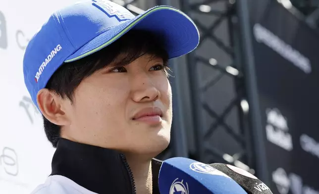 RB driver Yuki Tsunoda of Japan arrives in the paddock ahead of the Formula One Grand Prix at the Spa-Francorchamps racetrack in Spa, Belgium, Thursday, July 25, 2024. The Belgian Formula One Grand Prix will take place on Sunday. (AP Photo/Geert Vanden Wijngaert)