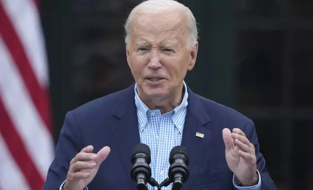 President Joe Biden speaks to active-duty military service members and their families during a Fourth of July celebration and barbecue on the South Lawn of the White House in Washington, Thursday, July 4, 2024. (AP Photo/Susan Walsh)