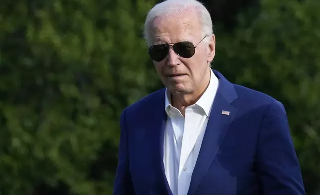 President Joe Biden walks across the South Lawn of the White House in Washington, Sunday, July 7, 2024, after returning from a trip to Pennsylvania. (AP Photo/Susan Walsh)