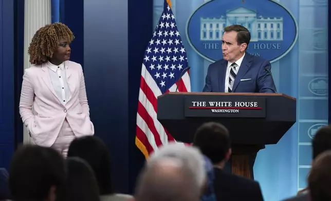 White House press secretary Karine Jean-Pierre looks on as White House national security communications advisor John Kirby speaks during the daily briefing at the White House, Thursday, July 25, 2024, in Washington. (AP Photo/Julia Nikhinson)