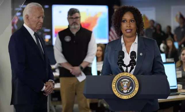President Joe Biden listens to District of Columbia Mayor Muriel Bowser during a visit to the D.C. Emergency Operations Center, Tuesday, July 2, 2024, in Washington. (AP Photo/Evan Vucci)