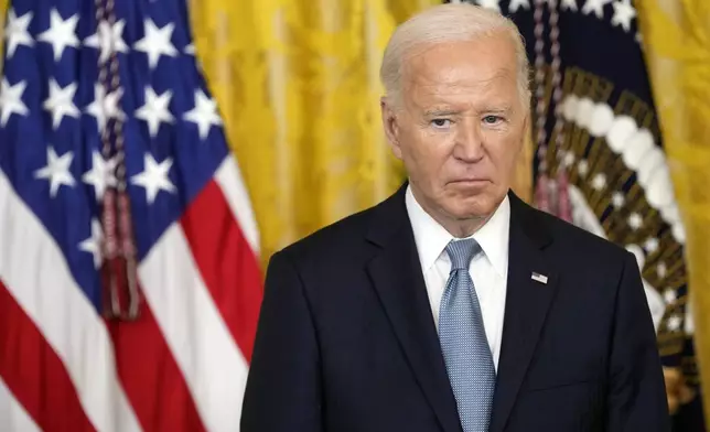 President Joe Biden listens during a Medal of Honor ceremony at the White House in Washington, Wednesday, July 3, 2024, posthumously honoring two U.S. Army privates who were part of a daring Union Army contingent that stole a Confederate train during the Civil War. U.S. Army Pvts. Philip G. Shadrach and George D. Wilson were captured by Confederates and executed by hanging. (AP Photo/Susan Walsh)