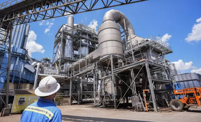 Dan Caston, an employee of Drax leads a tour of their plant in Gloster, Miss., Monday, May 20, 2024. Wood pellet production skyrocketed across the U.S. South to feed the European Union's push this past decade for renewable energy to replace fossil fuels like coal. (AP Photo/Gerald Herbert)