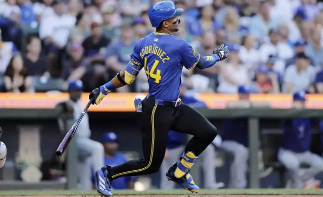 Seattle Mariners' Julio Rodriguez hits a single against the Toronto Blue Jays during the third inning in a baseball game, Friday, July 5, 2024, in Seattle. (AP Photo/John Froschauer)