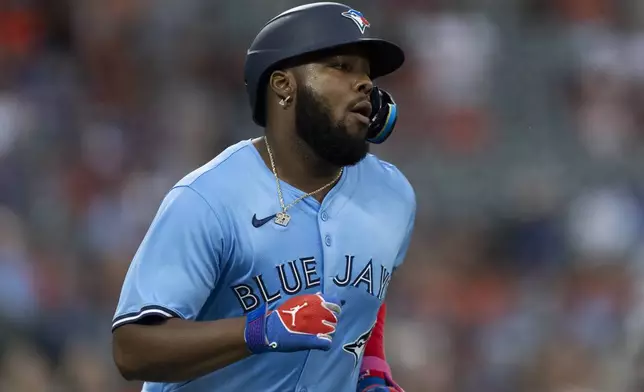 Toronto Blue Jays' Vladimir Guerrero Jr. walks during the fourth inning of a baseball game against the Baltimore Orioles, Tuesday, July 30, 2024, in Baltimore. (AP Photo/Stephanie Scarbrough)