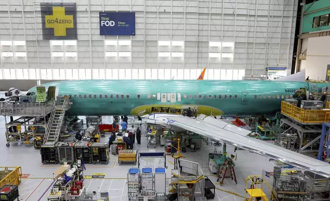 A Boeing 737 MAX aircraft is shown on the assembly line during a brief media tour at the Boeing facility in Renton, Wash., Tuesday, June 25, 2024. (Jennifer Buchanan/The Seattle Times via AP, Pool)