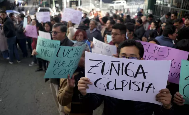 Supporters of President Luis Arce demonstrate outside the prosecutor's office demanding jail time for Juan Jose Zuniga, former commanding general of the army, in La Paz, Bolivia, Friday, June 28, 2024, two days after Army troops stormed the government palace in what President Luis Arce called a coup attempt. (AP Photo/Carlos Sanchez)
