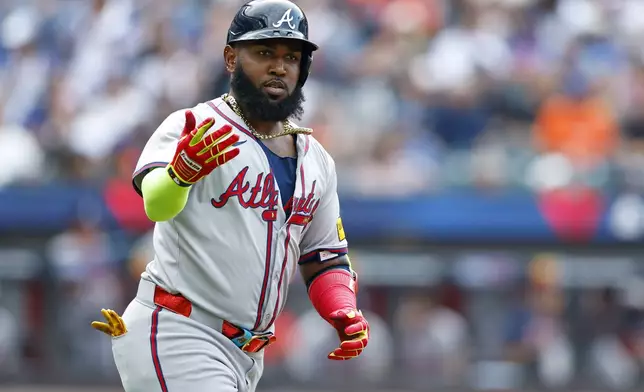 Atlanta Braves designated hitter Marcell Ozuna (20) gestures after he hit a home run during the fourth inning of a baseball game against the New York Mets, Saturday, July 27, 2024, in New York. (AP Photo/Rich Schultz)