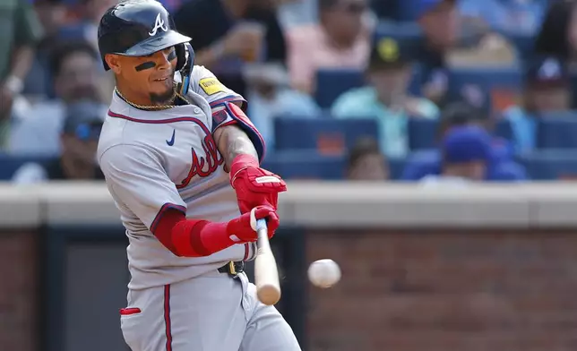 Atlanta Braves shortstop Orlando Arcia (11) hits an RBI single during the fifth inning of a baseball game against the New York Mets, Saturday, July 27, 2024, in New York. (AP Photo/Rich Schultz)