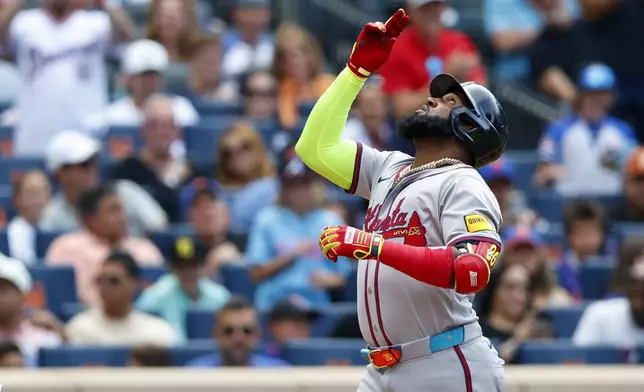 Atlanta Braves designated hitter Marcell Ozuna gestures as he crosses home plate after hitting a home run against the New York Mets during the fourth inning of a baseball game, Saturday, July 27, 2024, in New York. (AP Photo/Rich Schultz)