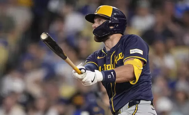 Milwaukee Brewers' Rhys Hoskins hits a grand slam during the fourth inning of a baseball game against the Los Angeles Dodgers Friday, July 5, 2024, in Los Angeles. (AP Photo/Mark J. Terrill)