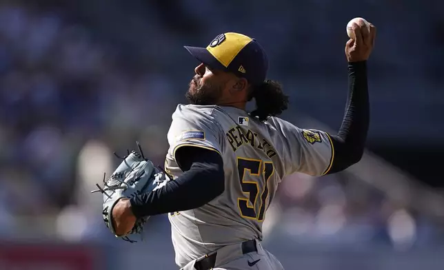 Milwaukee Brewers starting pitcher Freddy Peralta throws to the plate during the second inning of a baseball game against the Los Angeles Dodgers Saturday, July 6, 2024, in Los Angeles. (AP Photo/Mark J. Terrill)