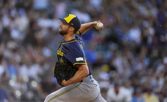 Milwaukee Brewers starting pitcher Colin Rea works against the Colorado Rockies in the second inning of a baseball game, Wednesday, July 3, 2024, in Denver. (AP Photo/David Zalubowski)