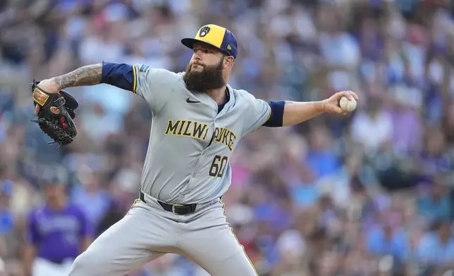 Milwaukee Brewers starting pitcher Dallas Keuchel works agianst the Colorado Rockies in the second inning of a baseball game Tuesday, July 2, 2024, in Denver. (AP Photo/David Zalubowski)