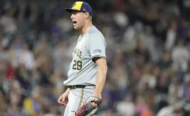 Milwaukee Brewers relief pitcher Trevor Megill reacts after striking out Colorado Rockies' Elias Diaz to end a baseball game Tuesday, July 2, 2024, in Denver. (AP Photo/David Zalubowski)