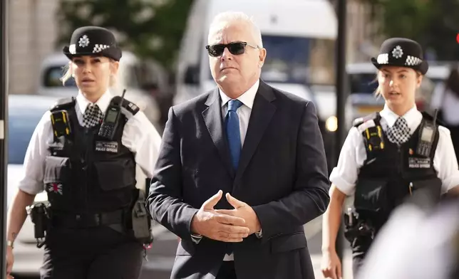 Former BBC broadcaster Huw Edwards arrives at Westminster Magistrates' Court in London, Wednesday July 31, 2024 where he is charged with three counts of making indecent images of children following a Metropolitan Police investigation. (Aaron Chown/PA via AP)