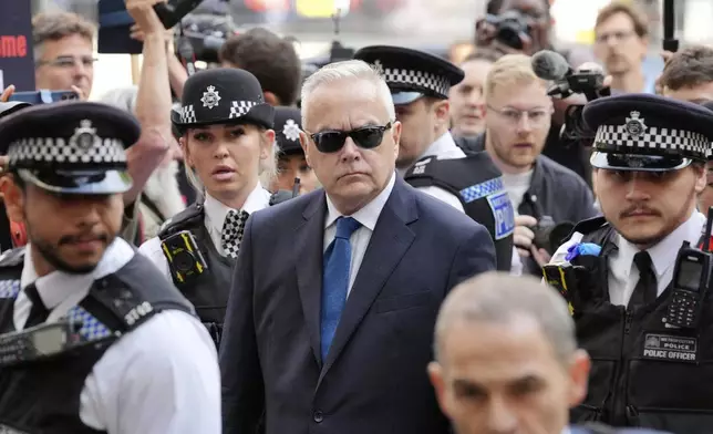 Former BBC broadcaster Huw Edwards arrives at Westminster Magistrates' Court in London, Wednesday July 31, 2024 where he is charged with three counts of making indecent images of children following a Metropolitan Police investigation. (Jonathan Brady/PA via AP)