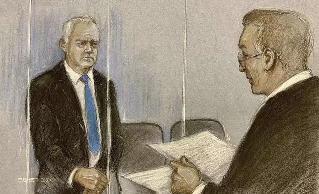 This court artist sketch by Elizabeth Cook of Chief Magistrate Paul Goldspring, right, with former BBC broadcaster Huw Edwards appearing at Westminster Magistrates' Court in London, Wednesday July 31, 2024 where he pleaded guilty to three counts of making indecent images of children. (Elizabeth Cook/PA via AP)