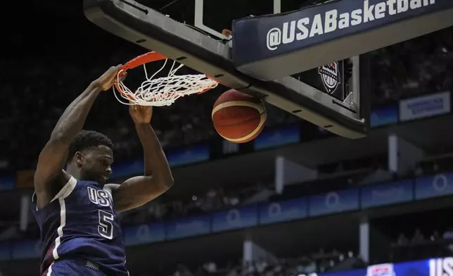 United States' guard Anthony Edwards scores during an exhibition basketball game between the United States and South Sudan, at the o2 Arena in London, Saturday, July 20, 2024. (AP Photo/Kin Cheung)