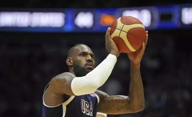 United States' forward LeBron James attempts to score during an exhibition basketball game between the United States and South Sudan, at the o2 Arena in London, Saturday, July 20, 2024. (AP Photo/Kin Cheung)