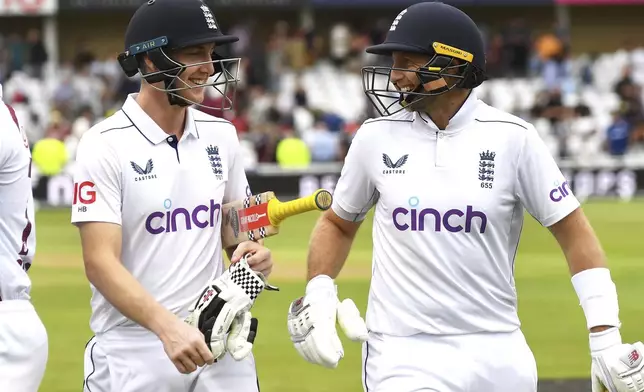 England's Joe Root, right, and England's Harry Brook, left, leave the pitch at end of play during day three of the second Test between England and West Indies at Trent Bridge cricket ground, Nottingham, England, Saturday, July 20, 2024. (AP Photo/Rui Vieira)