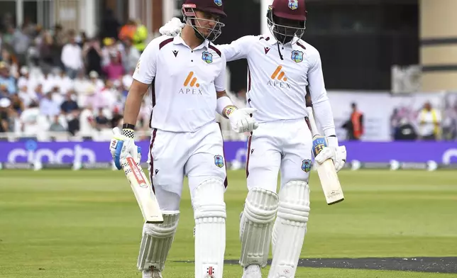 West Indies Joshua Da Silva, left, and West Indies Shamar Joseph leave the pitch after West Indies first innings during day three of the second Test between England and West Indies at Trent Bridge cricket ground, Nottingham, England, Saturday, July 20, 2024. (AP Photo/Rui Vieira)