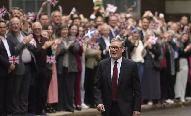 Britain's Prime Minister Keir Starmer outside 10 Downing Street in London, Friday, July 5, 2024 after returning from seeing King Charles III where he was asked to form a government. Starmer's Labour Party swept to power Friday after more than a decade in opposition, as a jaded electorate handed the party a landslide victory — but also a mammoth task of reinvigorating a stagnant economy and dispirited nation. (AP Photo/Vadim Ghirda)