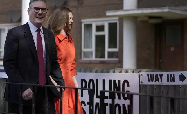 Labour Party leader Keir Starmer and wife Victoria arrive at a polling station to cast their vote in London, Thursday, July 4, 2024. Voters in the U.K. are casting their ballots in a national election to choose the 650 lawmakers who will sit in Parliament for the next five years. Outgoing Prime Minister Rishi Sunak surprised his own party on May 22 when he called the election. (AP Photo/Vadim Ghirda)