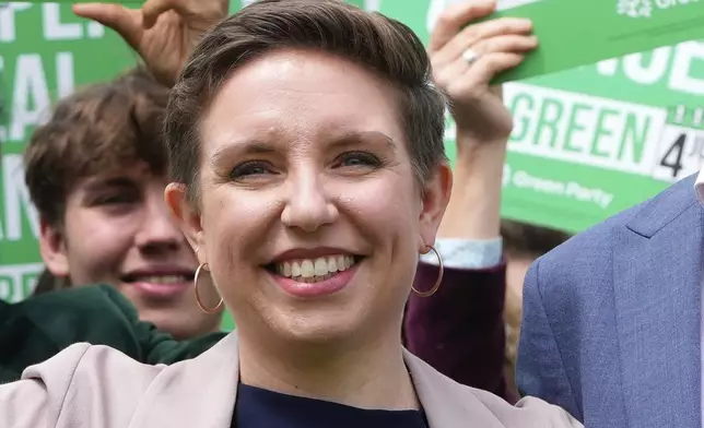 FILE - Green Party co-leader Carla Denyer poseS with supporters at their General Election Manifesto launch in Hove, England, Wednesday, June 12, 2024. (AP Photo/Kirsty Wigglesworth, File)