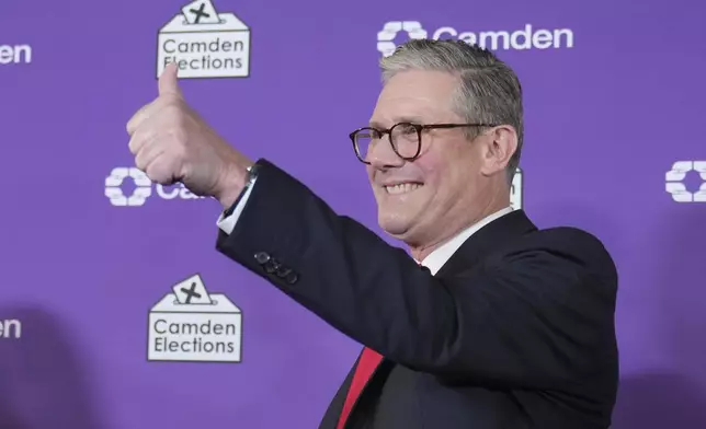 Britain's Labour Party leader Keir Starmer gives a thumbs up to his supporters after he was elected for the Holborn and St Pancras constituency, in London, Friday, July 5, 2024. Britain's Labour Party appears to be headed for a huge majority in the 2024 UK election, an exit poll suggested. The poll released moments after voting closed indicated that Labour leader Keir Starmer will be the country's next prime minister.(AP Photo/Kin Cheung)
