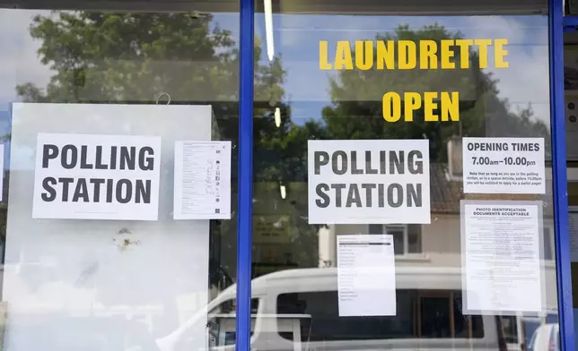 A polling station is installed inside a launderette for the 2024 General Election, in Oxford, England, Thursday July 4, 2024. (Jacob King/PA via AP)