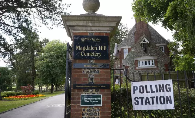 A sign for polling station is set up at Magdalen Hill Cemetery near Winchester, England, Thursday, July 4, 2024. (Andrew Matthews/PA via AP)