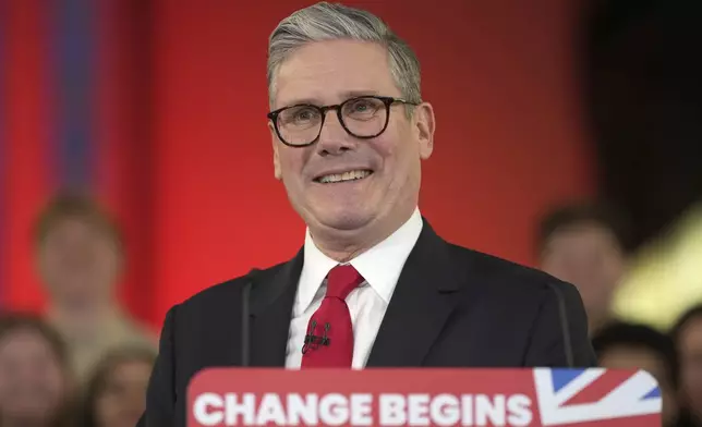 FILE - Labour Party leader Keir Starmer smiles as he speaks to his supporters at the Tate Modern in London, Friday, July 5, 2024. After a few hours of sleep to shake off a night of celebration and an audience with the king, Keir Starmer will step through the front door of 10 Downing St. for the first time as prime minister on Friday. (AP Photo/Kin Cheung, File)