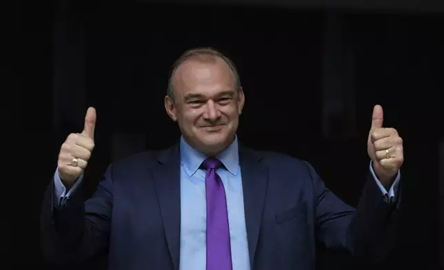 FILE - Ed Davey poses for the media after he is announced as the new Liberal Democrat Leader, in London, on Aug. 27, 2020. (AP Photo/Kirsty Wigglesworth, File)