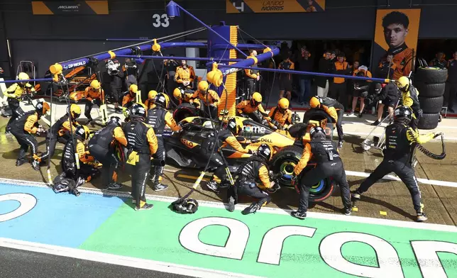 McLaren driver Lando Norris of Britain gets a pit service during the British Formula One Grand Prix race at the Silverstone racetrack, Silverstone, England, Sunday, July 7, 2024. (Andrew Boyers/Pool Photo via AP)