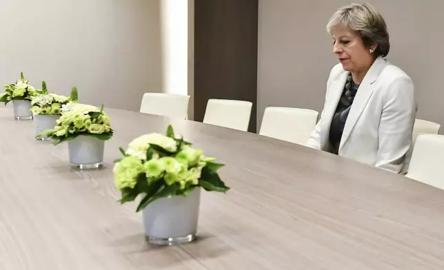 FILE - British Prime Minister Theresa May waits for the arrival of European Council President Donald Tusk prior to their bilateral meeting at an EU summit in Brussels, Belgium, Oct. 20, 2017. The U.K. election in December 2019 was basically about one issue: Brexit. General elections in the U.K. are typically held in the spring or early summer. But in the fall of 2019, the recently-appointed Prime Minister Boris Johnson gambled on holding one on December 12, when most people just want to get ready for Christmas and would rather think of anything but politics. (AP Photo/Geert Vanden Wijngaert, Pool)