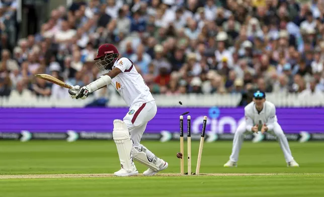 West Indies' Kraigg Brathwaite is bowled out by England's Gus Atkinson, not in picture, on day one of the first Rothesay Men's Test match at Lord's Cricket Ground, London, Wednesday, July 10, 2024. (Steven Paston/PA via AP)