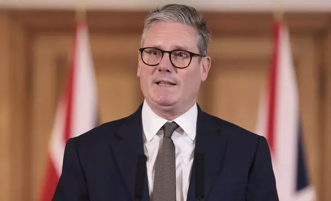 British Prime Minister Keir Starmer delivers a speech following his first cabinet meeting as Prime Minister, in London, Saturday July 6, 2024. (Claudia Greco/Pool via AP)