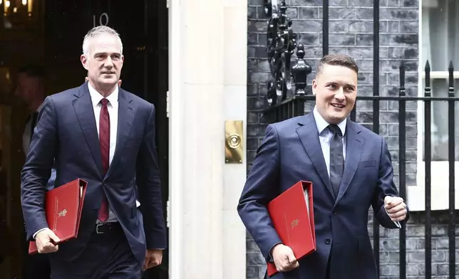 Britain's Science Secretary Peter Kyle, left, and Health Secretary Wes Streeting leave 10 Downing Street, London, Saturday July 6, 2024, after taking part in Prime Minister Keir Starmer's first Cabinet meeting following the General Election victory for the Labour Party. (Tejas Sandhu/PA via AP)