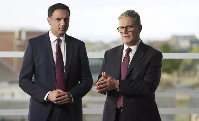 British Prime Minister Sir Keir Starmer, right, and Scottish Labour Leader Anas Sarwar during an event in Edinburgh to welcome new Labour MPs in Scotland, following Labour's victory in the 2024 General Election, Sunday July 7, 2024. (Andrew Milligan/PA via AP)