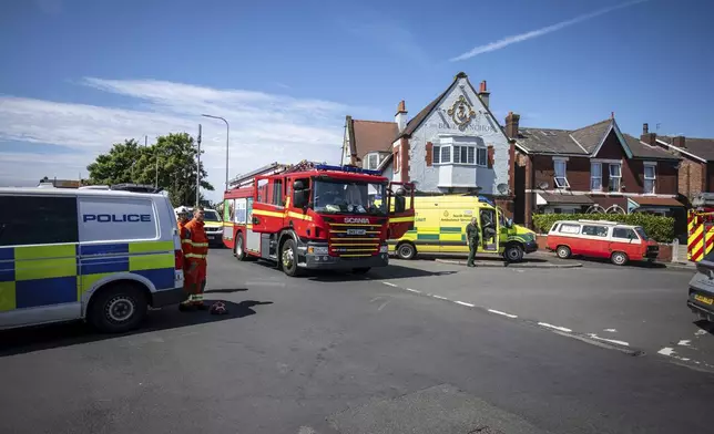 Emergency services work at the scene in Southport, Merseyside, where a man has been detained and a knife has been seized after a number of people were injured in a reported stabbing, Monday July 29, 2024. (James Speakman/PA via AP)