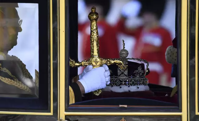 The Imperial State Crown is seen in a carriage as it is taken to the Parliament, on the day of the State Opening in London, Wednesday, July 17, 2024. (Chris J. Ratcliffe/POOL via AP)