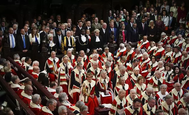 Members of the House of Commons, including Liberal Democrat leader Sir Ed Davey, Defence Secretary John Healey, Deputy Prime Minister Angela Rayner, Prime Minister Sir Keir Starmer, former prime Minister Rishi Sunak, Foreign Secretary David Lammy, Oliver Dowden, Education Secretary Bridget Phillipson, former chancellor of the exchequer Jeremy Hunt, SNP Westminster leader Stephen Flynn, Mother of the House Diane Abbot, Father of the House Sir Edward Leigh, Stuart Andrew, Home Secretary Yvette Cooper, and former home secretary James Cleverly, listen to the King's Speech during the State Opening of Parliament in chamber of the House of Lords at the Palace of Westminster, London, Wednesday, July 17, 2024. (Aaron Chown/POOL via AP)