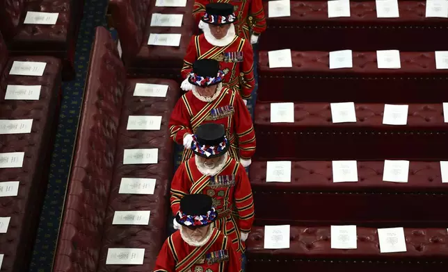 The King's Bodyguard the Yeomen of the Guard take part in a ceremonial search in the House of Lords Chamber, ahead of the State Opening of Parliament, in the Houses of Parliament, in London, Wednesday, July 17, 2024. (Henry Nicholls/POOL via AP)